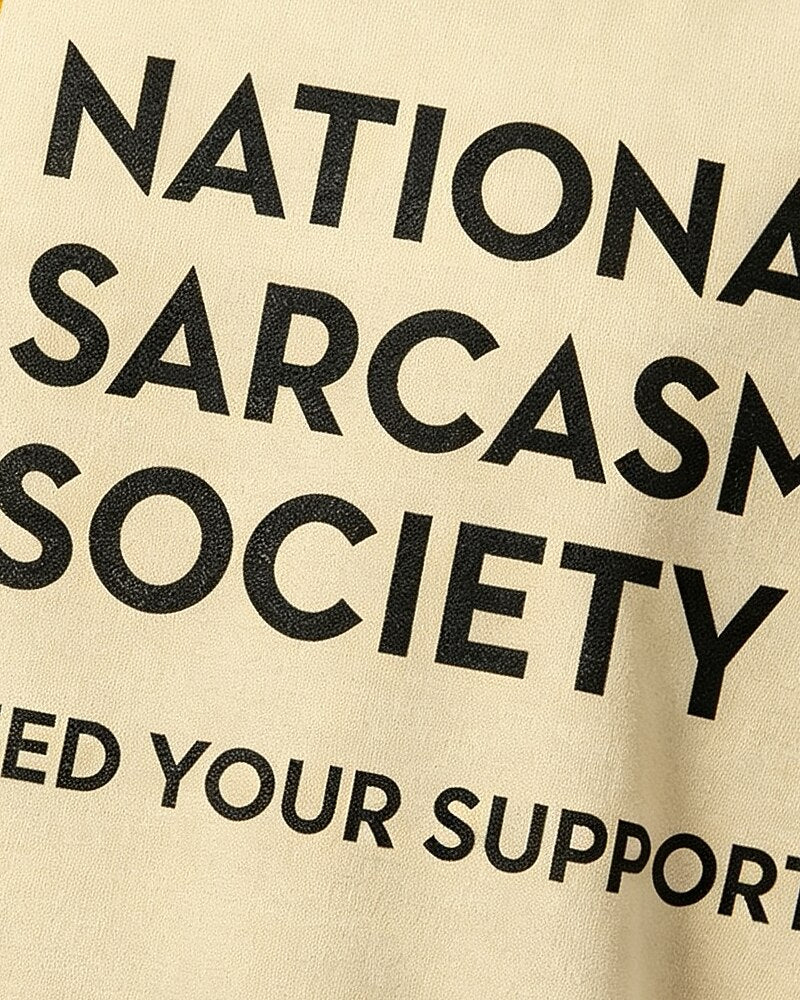 National Sarcasm Society: Like We Need Your Support quote on Beige cotton T-shirt