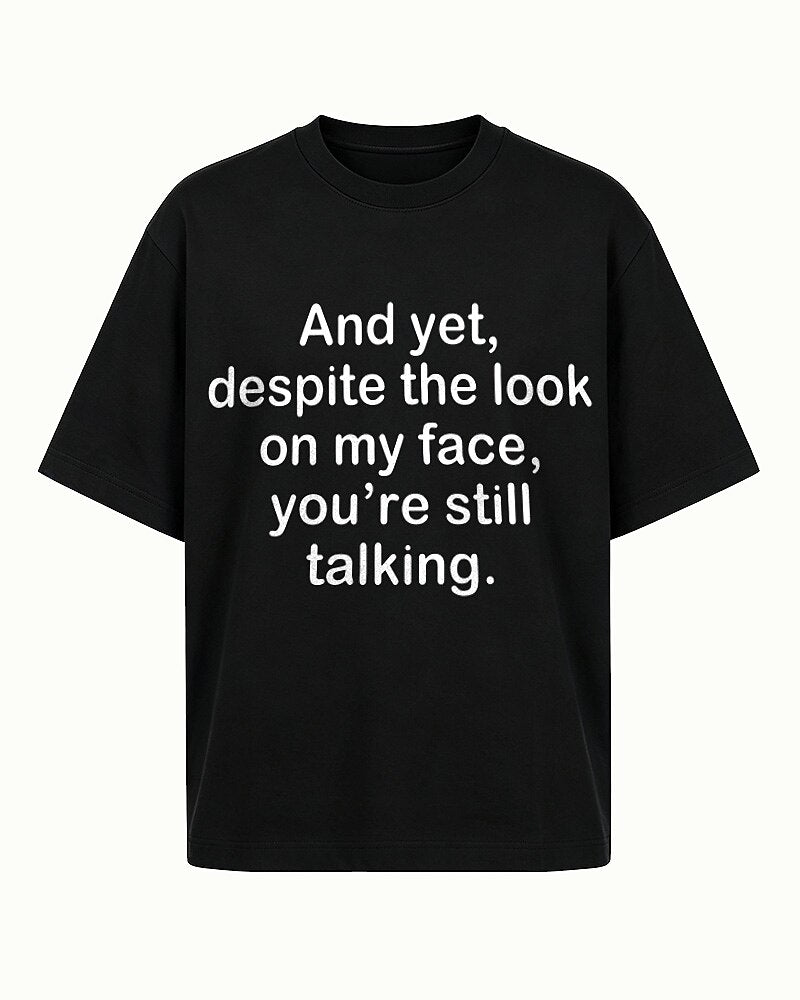 Despite the Look on My Face, You're Still Talking quote on Black cotton T-shirt